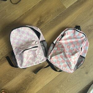 Pink/white checkerboard backpack, size medium. Perfect for Elementary.
